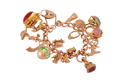 Lot 722 - A GOLD CHARM BRACELET
