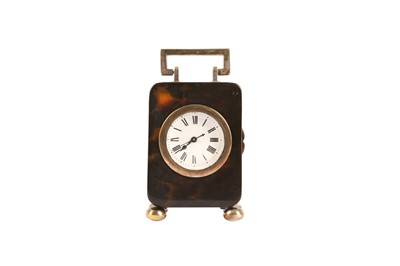 Lot 302 - AN EARLY 20TH CENTURY TORTOISESHELL AND SILVER MINIATURE TRAVEL CLOCK BY H. AUMONT & CO.