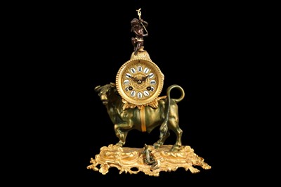 Lot 319 - A LOUIS XV STYLE GILT AND PATINTED BRONZE CLOCK MODELLED WITH A BULL