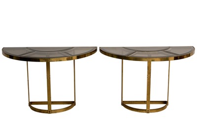 Lot 227 - A PAIR OF SMOKED GLASS AND GILT-METAL DEMI LUNE CONSOLE TABLES