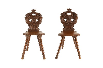 Lot 215 - A PAIR OF 19TH CENTURY FRENCH OAK HALL CHAIRS CARVED WITH CARYATIDS
