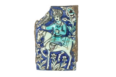Lot 508 - A FRAGMENTARY MOULDED QAJAR POTTERY TILE