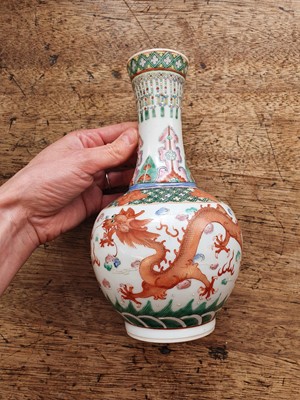 Lot 27 - A PAIR OF CHINESE FAMILLE ROSE 'DRAGON' BOTTLE VASES.