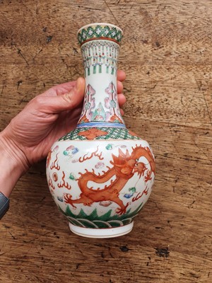 Lot 27 - A PAIR OF CHINESE FAMILLE ROSE 'DRAGON' BOTTLE VASES.