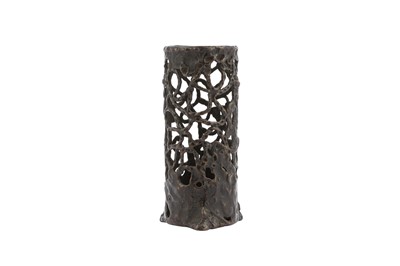Lot 673 - A BRONZE RETICULATED JOSS STICK HOLDER.