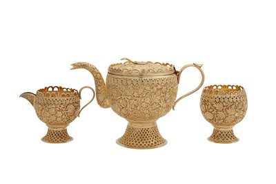 Lot 99 - An early 20th century Anglo - Indian unmarked silver gilt three-piece tea service, Kashmir circa 1900