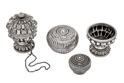Lot 213 - A group of four 20th century Sumatran (Indonesian) unmarked silver lime / betel boxes