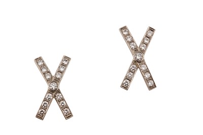 Lot 104 - A pair of diamond earrings