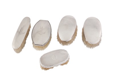 Lot 872 - A MIXED GROUP OF GEORGE V STERLING SILVER CLOTHES BRUSHES