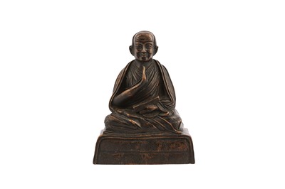 Lot 635 - A SINO-TIBETAN COPPER ALLOY FIGURE OF A LOUHAN.
