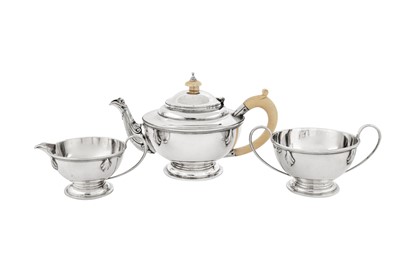 Lot 570 - A George V Art Deco sterling silver three-piece tea service, London 1931 by Charles Boyton