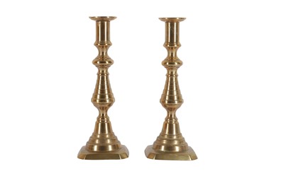 Lot 300 - A PAIR OF VICTORIAN BRASS CANDLESTICKS