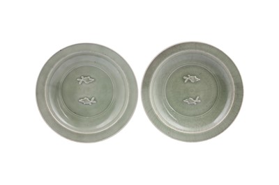 Lot 1025 - A PAIR OF CHINESE LONGQUAN CELADON 'FISH' DISHES.