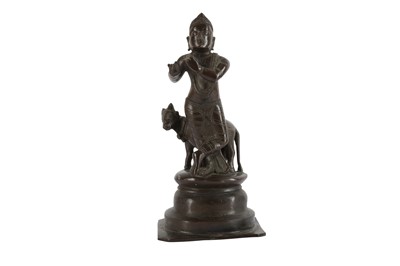 Lot 396 - AN INDIAN BRONZE MODEL OF KRISHNA, 20TH CENTURY