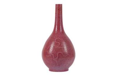 Lot 143 - A CHINESE PINK-GROUND SGRAFFITO 'DRAGON' BOTTLE VASE.