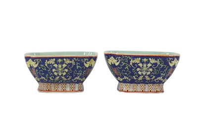 Lot 21 - A PAIR OF CHINESE FAMILLE ROSE BLUE-GROUND 'LOTUS AND BATS' BOWLS.