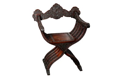 Lot 446 - AN ANGLO-INDIAN CARVED WOOD SAVONAROLA FOLDING CHAIR