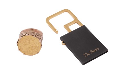 Lot 768 - A HALF SOVEREIGIN RING AND A DE BEERS KEYRING