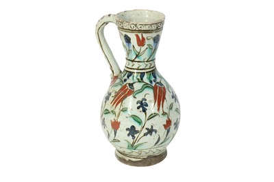Lot 502 - AN IZNIK POTTERY JUG