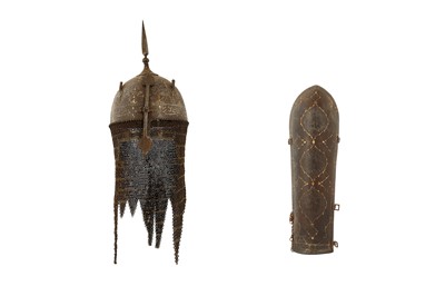 Lot 437 - A QAJAR GOLD-DAMASCENED STEEL HELMET (KHULA KHUD) AND ARMGUARD (BAZUBAND)