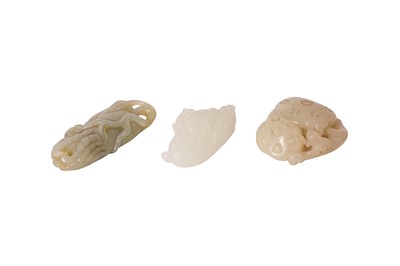 Lot 260 - THREE CHINESE PALE CELADON JADE PENDANTS.