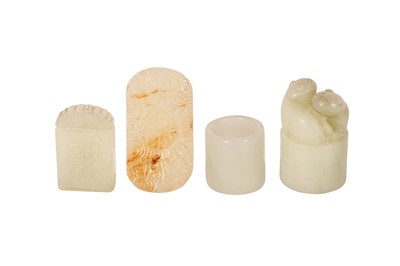 Lot 68 - TWO CHINESE PALE CELADON JADE PLAQUES, AN ARCHER'S RING AND A SEAL.