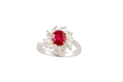 Lot 182 - A ruby and diamond cluster ring