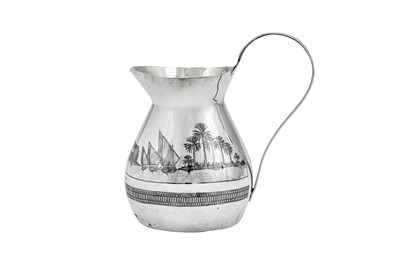 Lot 359 - An early 20th century Iraqi silver and niello milk jug, circa 1930 signed Omara Amir