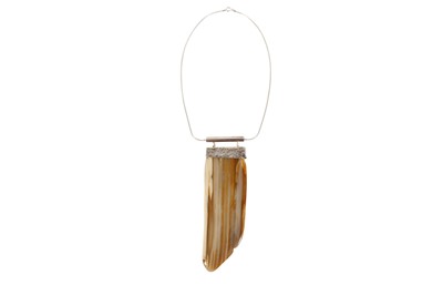 Lot 356 - A MODERN PETRIFIED WOOD PENDANT