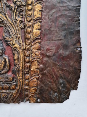 Lot 186 - A NEPALESE GILT-BRONZE PLAQUE FRAGMENT.