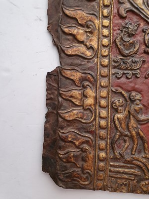 Lot 186 - A NEPALESE GILT-BRONZE PLAQUE FRAGMENT.