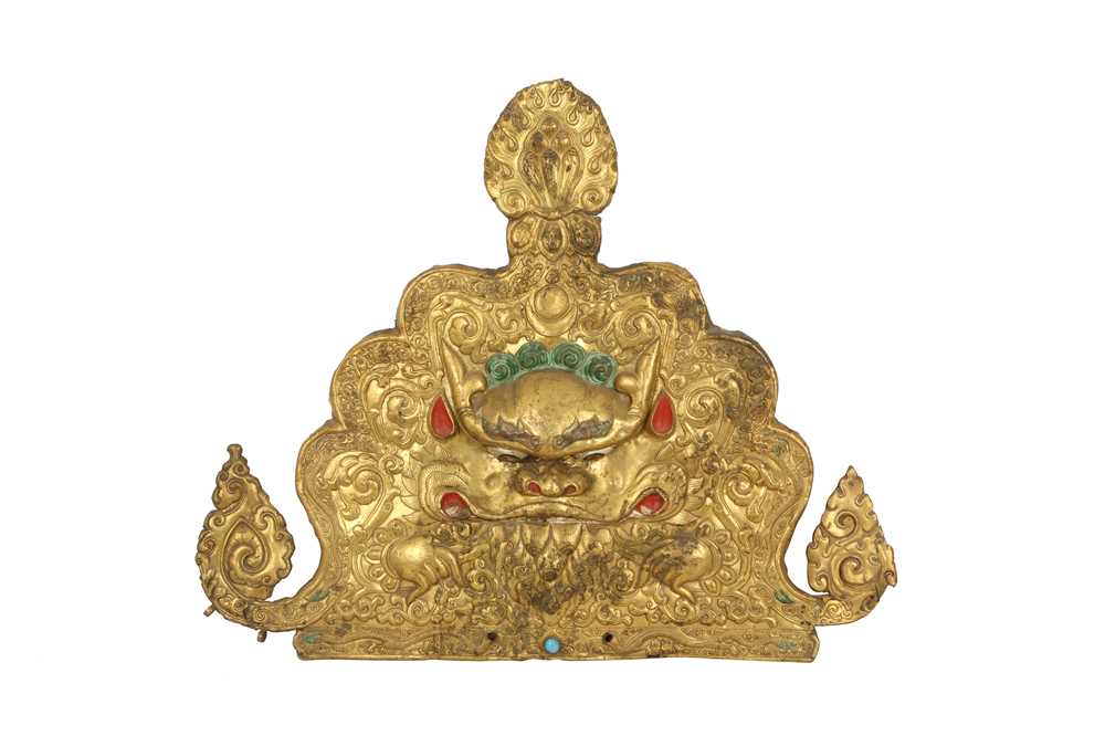 Lot 187 - A TIBETAN GILT-COPPER 'KIRTIMUKHA' PLAQUE.