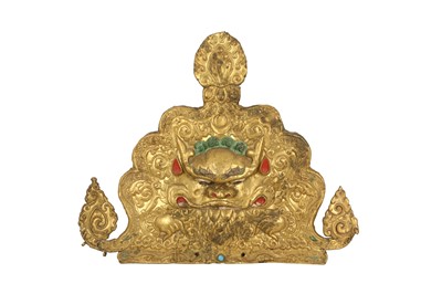 Lot 187 - A TIBETAN GILT-COPPER 'KIRTIMUKHA' PLAQUE.