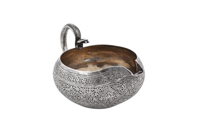 Lot 140 - A late 19th / early 20th century Anglo - Indian unmarked silver milk jug, Kashmir circa 1900