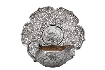 Lot 140 - A late 19th / early 20th century Anglo - Indian unmarked silver milk jug, Kashmir circa 1900