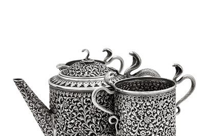 Lot 178 - A late 19th / early 20th century Anglo – Indian silver three-piece tea service, Cutch, Bhuj circa 1900 by Oomersi Mawji jnr (active 1890-1930)