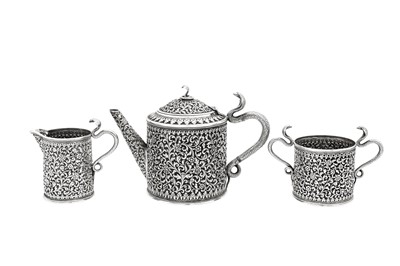 Lot 178 - A late 19th / early 20th century Anglo – Indian silver three-piece tea service, Cutch, Bhuj circa 1900 by Oomersi Mawji jnr (active 1890-1930)