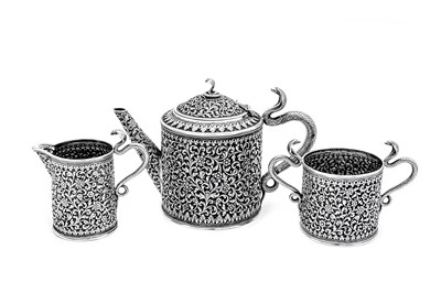 Lot 178 - A late 19th / early 20th century Anglo – Indian silver three-piece tea service, Cutch, Bhuj circa 1900 by Oomersi Mawji jnr (active 1890-1930)