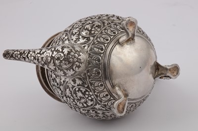 Lot 170 - A late 19th century Anglo – Indian unmarked silver teapot, Cutch circa 1880