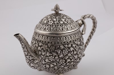 Lot 170 - A late 19th century Anglo – Indian unmarked silver teapot, Cutch circa 1880