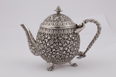 Lot 170 - A late 19th century Anglo – Indian unmarked silver teapot, Cutch circa 1880