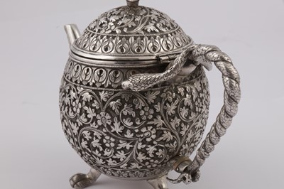 Lot 170 - A late 19th century Anglo – Indian unmarked silver teapot, Cutch circa 1880