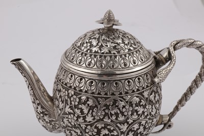 Lot 170 - A late 19th century Anglo – Indian unmarked silver teapot, Cutch circa 1880