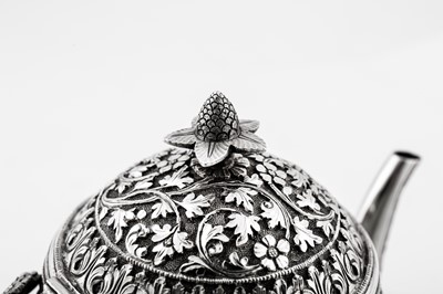 Lot 170 - A late 19th century Anglo – Indian unmarked silver teapot, Cutch circa 1880