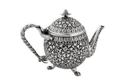 Lot 170 - A late 19th century Anglo – Indian unmarked silver teapot, Cutch circa 1880