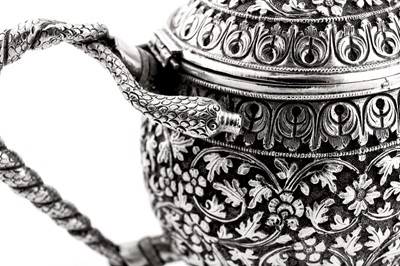 Lot 170 - A late 19th century Anglo – Indian unmarked silver teapot, Cutch circa 1880
