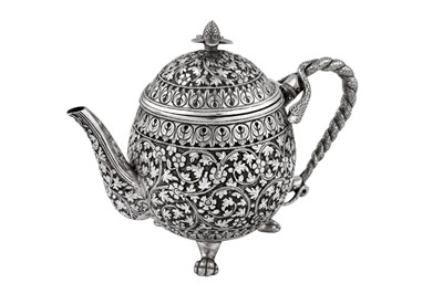 Lot 170 - A late 19th century Anglo – Indian unmarked silver teapot, Cutch circa 1880