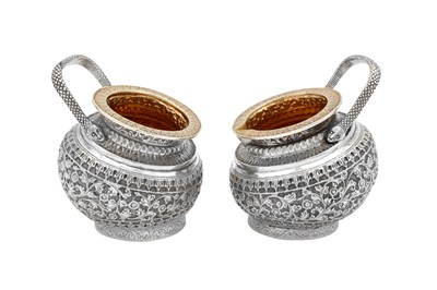 Lot 141 - A late 19th century Anglo – Indian unmarked silver sugar bowl and milk jug, Kashmir circa 1890