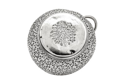 Lot 159 - A late 19th century Indian unmarked silver milk jug and sugar bowl with sugar tongs, Lucknow circa 1890
