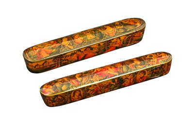 Lot 235 - TWO LACQUERED PAPIER-MÂCHÉ PEN CASES (QALAMDAN) WITH CHRISTIAN THEMES